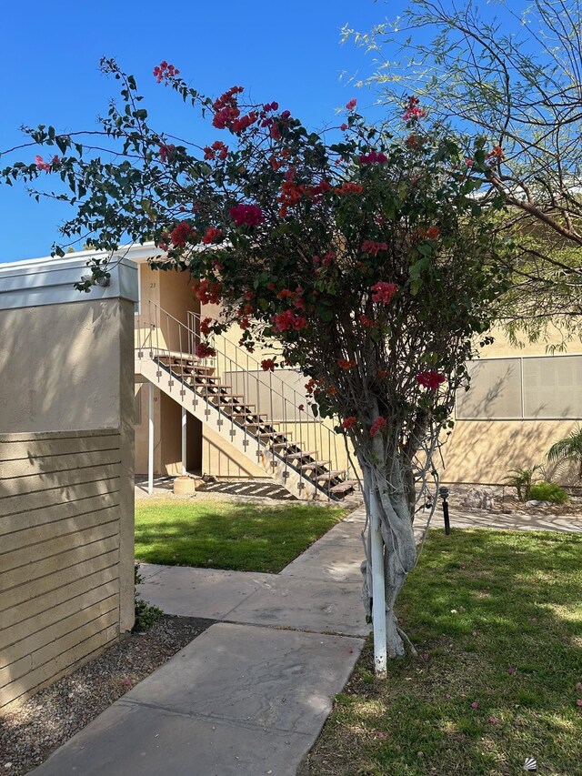 500 E Country Club Dr # 24, Yuma, AZ 85365 - view of side of property with stairs and stucco siding