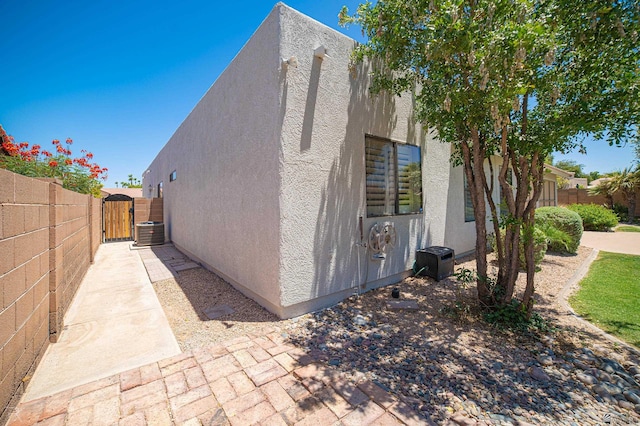 10388 S Fairway Loop, Yuma, AZ 85367 - view of side of home with a gate and stucco siding