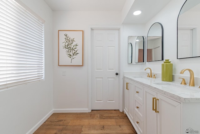 1087 W Palmcroft Dr, Yuma, AZ 85364 - full bathroom featuring wood finished floors, double vanity, healthy amount of natural light, and recessed lighting