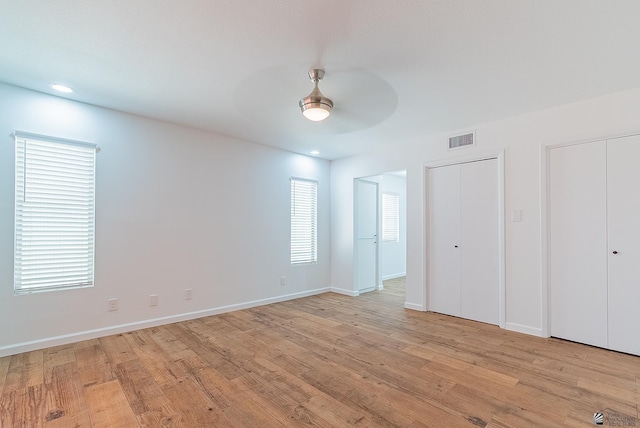1087 W Palmcroft Dr, Yuma, AZ 85364 - unfurnished bedroom with two closets, light wood-type flooring, a ceiling fan, and recessed lighting