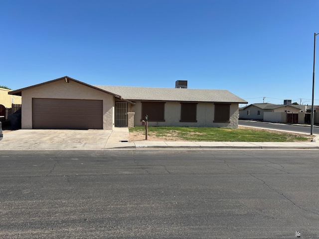 2514 W 21st St, Yuma, AZ 85364 - ranch-style home featuring an attached garage, concrete driveway, and stucco siding