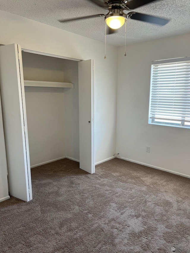 2514 W 21st St, Yuma, AZ 85364 - unfurnished bedroom with carpet, a textured ceiling, a closet, ceiling fan, and baseboards