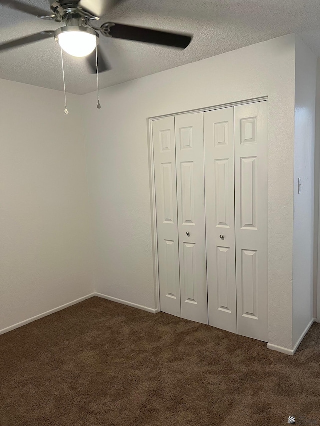 2514 W 21st St, Yuma, AZ 85364 - unfurnished bedroom with carpet, a closet, baseboards, a ceiling fan, and a textured ceiling