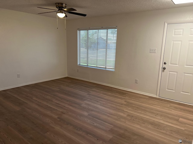 2514 W 21st St, Yuma, AZ 85364 - unfurnished room with a ceiling fan, dark wood-style flooring, and baseboards