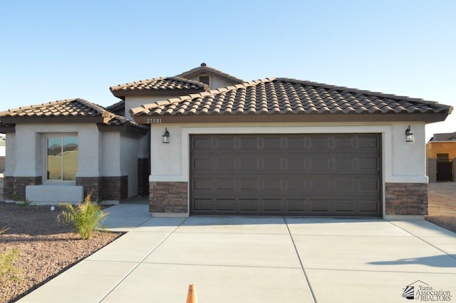 mediterranean / spanish-style house featuring a garage