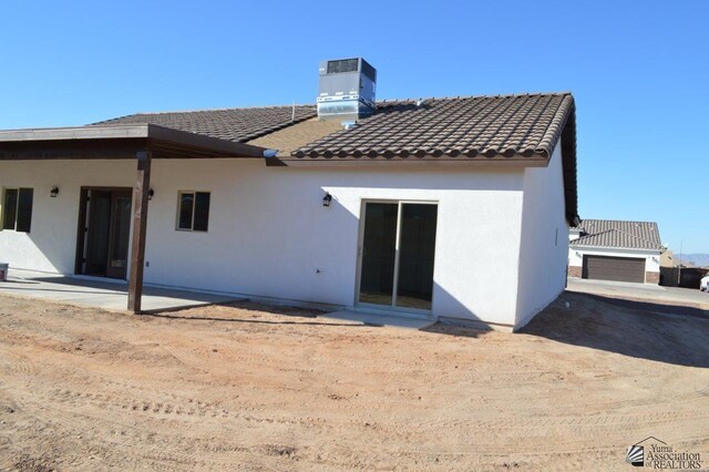 13135 E 55th Ln Lot 18, Yuma, AZ 85367 - rear view of property with a patio, cooling unit, a tile roof, and stucco siding