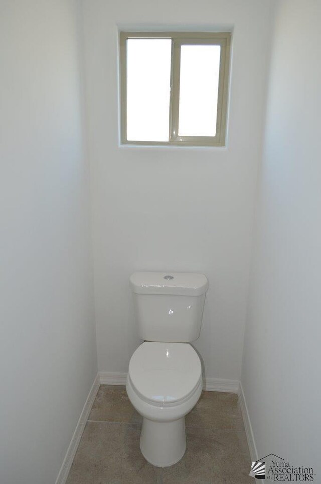 13135 E 55th Ln Lot 18, Yuma, AZ 85367 - bathroom featuring baseboards and toilet