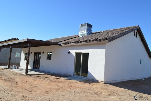 13135 E 55th Ln Lot 18, Yuma, AZ 85367 - back of property featuring central air condition unit, a patio, stucco siding, and a tile roof