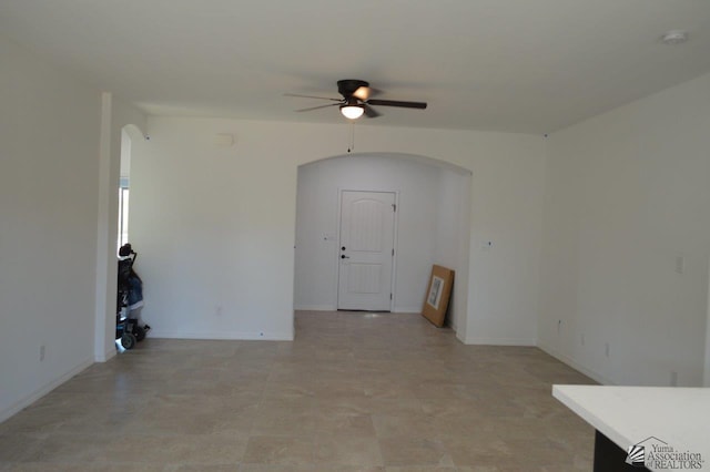 13135 E 55th Ln Lot 18, Yuma, AZ 85367 - unfurnished room featuring arched walkways, baseboards, and a ceiling fan