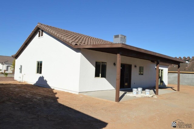 13135 E 55th Ln Lot 18, Yuma, AZ 85367 - rear view of house featuring a patio, a tile roof, and stucco siding