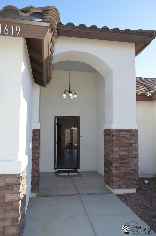 13135 E 55th Ln Lot 18, Yuma, AZ 85367 - doorway to property with stucco siding and stone siding