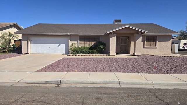 7196 E 25th Pl, Yuma, AZ 85365 - ranch-style house with stucco siding, a garage, and driveway