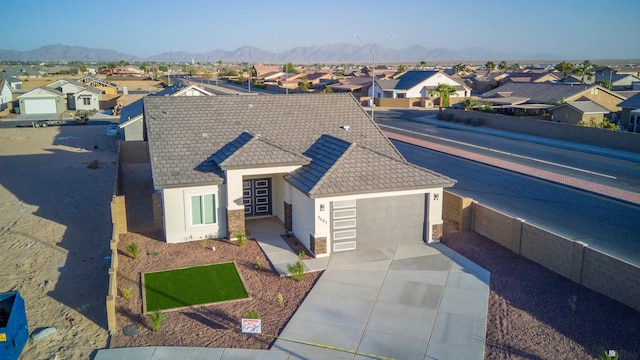 drone / aerial view featuring a mountain view and a residential view
