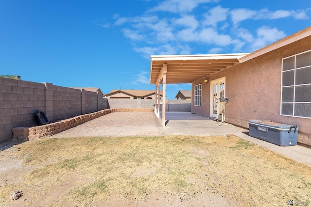 view of yard featuring a fenced backyard and a patio area