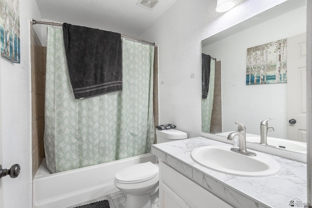 full bathroom with visible vents, vanity, a textured wall, toilet, and shower / tub combo