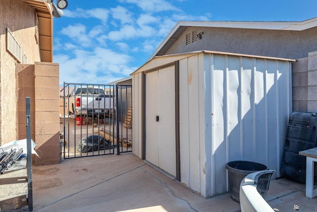 view of shed with a gate