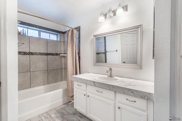 full bath featuring vanity, shower / bath combo with shower curtain, and wood finished floors