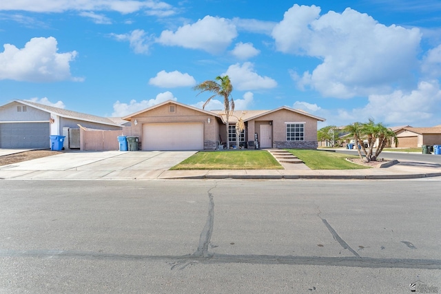 single story home with a front lawn, stone siding, stucco siding, an attached garage, and driveway
