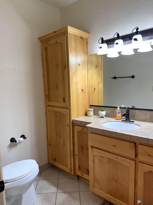 14818 E 52nd St, Yuma, AZ 85367 - bathroom with toilet, tile patterned floors, and vanity