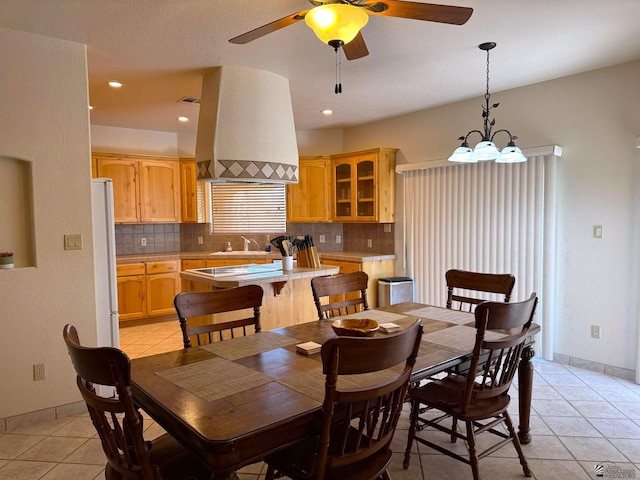 14818 E 52nd St, Yuma, AZ 85367 - dining room with baseboards, recessed lighting, ceiling fan with notable chandelier, and light tile patterned flooring