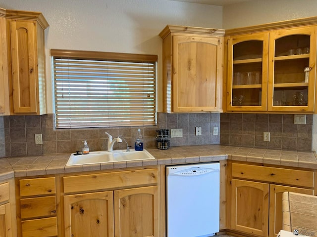 14818 E 52nd St, Yuma, AZ 85367 - kitchen with white dishwasher, decorative backsplash, a sink, and glass insert cabinets