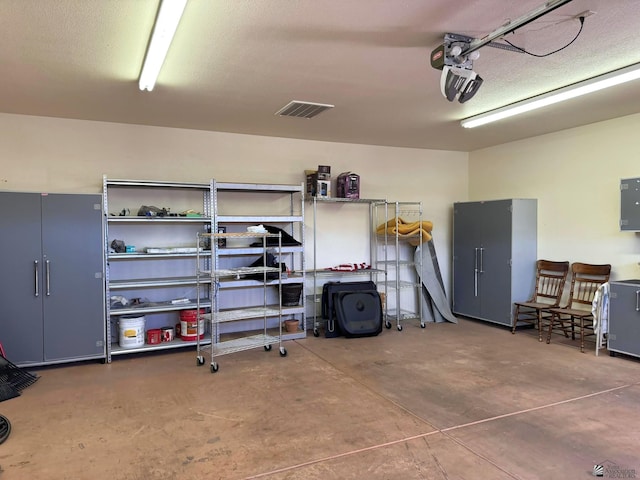 14818 E 52nd St, Yuma, AZ 85367 - garage with electric panel, a garage door opener, and visible vents