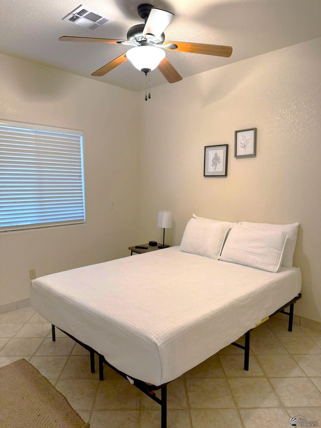 14818 E 52nd St, Yuma, AZ 85367 - bedroom featuring baseboards, ceiling fan, light tile patterned flooring, and visible vents
