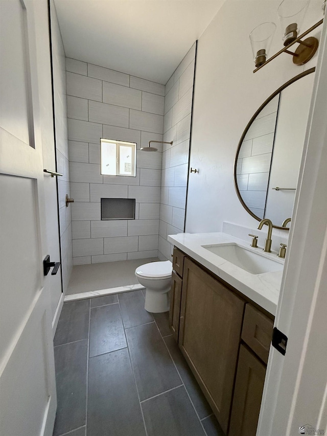 12377 W Calle Ln, Primera, Yuma, AZ 85367 - full bathroom featuring vanity, tile patterned floors, a tile shower, and toilet