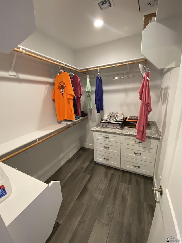14673 E 52nd St, Yuma, AZ 85367 - walk in closet featuring dark wood-style flooring and visible vents