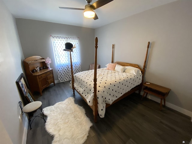 14673 E 52nd St, Yuma, AZ 85367 - bedroom with dark wood-style flooring, ceiling fan, and baseboards