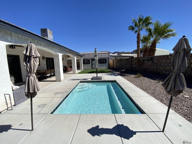 14673 E 52nd St, Yuma, AZ 85367 - view of swimming pool featuring a fenced in pool, a fenced backyard, ceiling fan, and a patio area