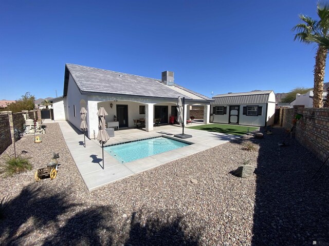 14673 E 52nd St, Yuma, AZ 85367 - view of pool with a fenced backyard, a fenced in pool, an outdoor structure, and a patio area