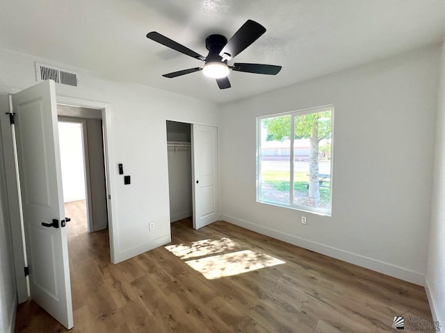2461 S 17th Ave, Yuma, AZ 85364 - unfurnished bedroom with wood finished floors, a closet, and ceiling fan