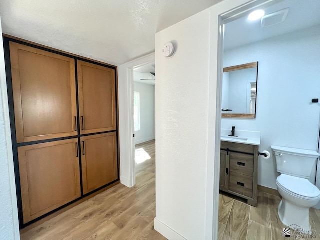 2461 S 17th Ave, Yuma, AZ 85364 - bathroom with vanity and wood finished floors