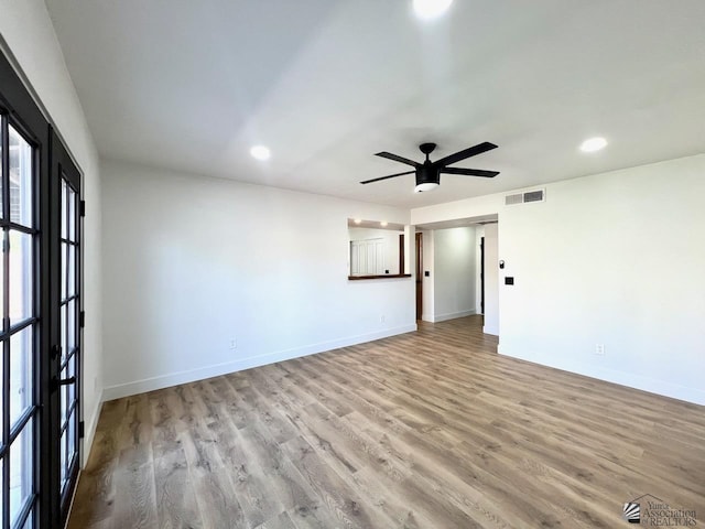 2461 S 17th Ave, Yuma, AZ 85364 - empty room with a ceiling fan, wood finished floors, and recessed lighting