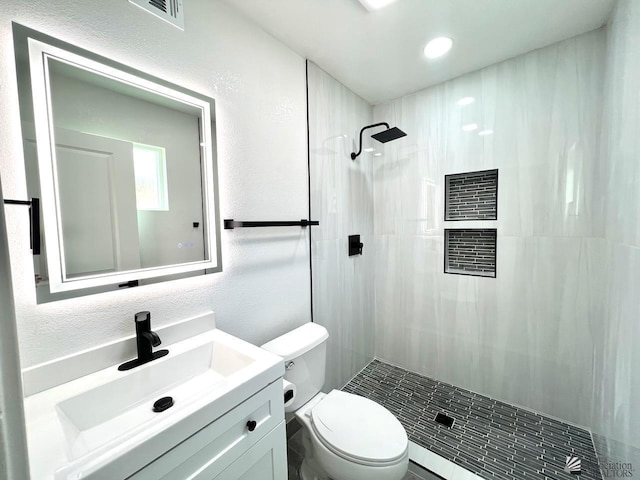 2461 S 17th Ave, Yuma, AZ 85364 - full bath with tiled shower, vanity, recessed lighting, and a textured wall