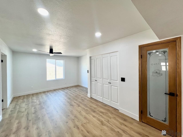 2461 S 17th Ave, Yuma, AZ 85364 - unfurnished bedroom with recessed lighting, light wood-style floors, ceiling fan, a textured ceiling, and a closet
