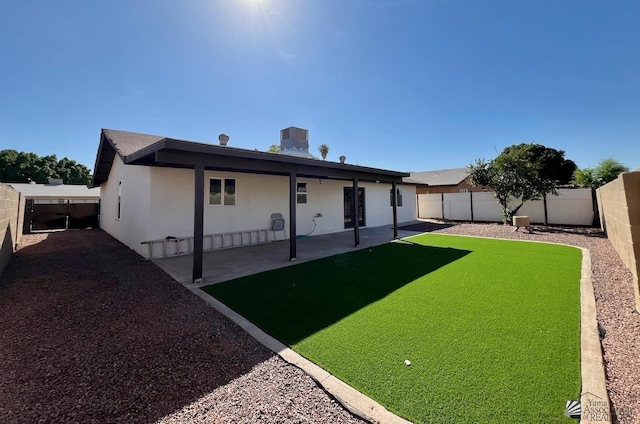 2461 S 17th Ave, Yuma, AZ 85364 - rear view of property featuring a fenced backyard, stucco siding, and a patio area