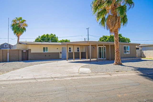 1911 W 18th St, Yuma, AZ 85364 - ranch-style house with brick siding, fence, driveway, and an attached carport