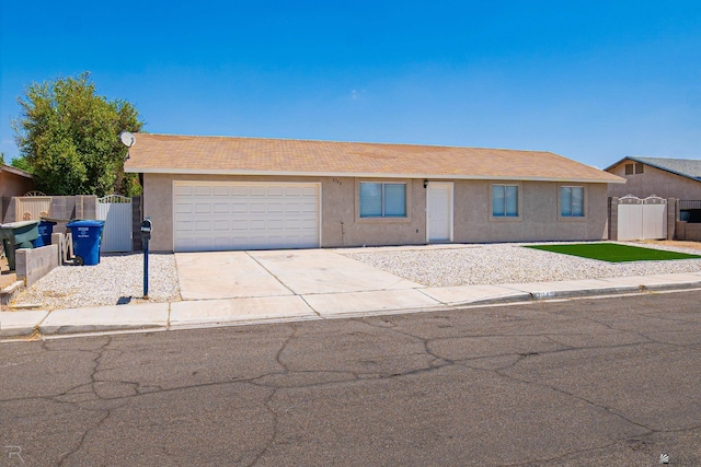 2794 W 27th Ln, Yuma, AZ 85364 - view of front of home with a garage, concrete driveway, and stucco siding