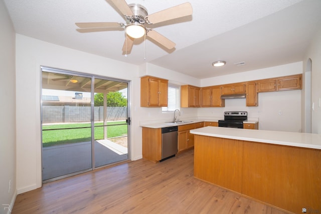 2794 W 27th Ln, Yuma, AZ 85364 - kitchen with black range with electric cooktop, stainless steel dishwasher, light countertops, and light wood-style floors