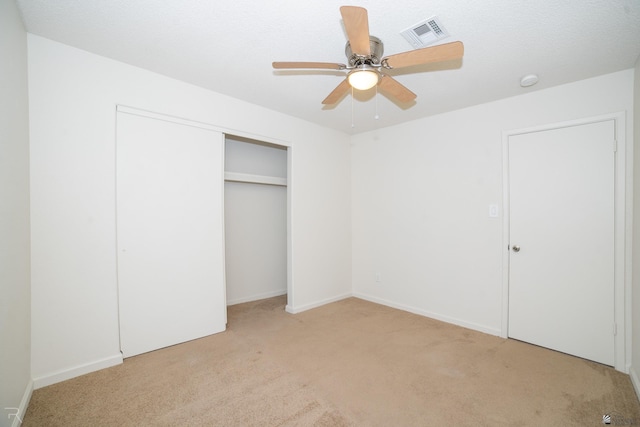 2794 W 27th Ln, Yuma, AZ 85364 - unfurnished bedroom with light carpet, a closet, and a ceiling fan