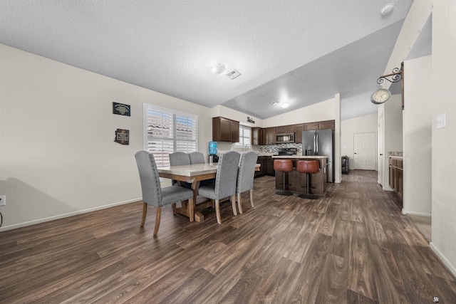 4841 W 10th Pl, Yuma, AZ 85364 - dining room with dark wood finished floors, lofted ceiling, and a textured ceiling