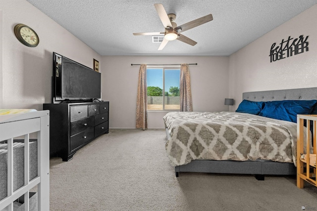 4841 W 10th Pl, Yuma, AZ 85364 - bedroom featuring a textured ceiling, carpet floors, and a ceiling fan