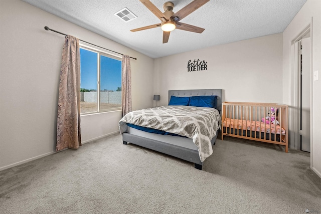 4841 W 10th Pl, Yuma, AZ 85364 - carpeted bedroom featuring a textured ceiling and ceiling fan