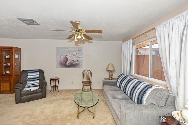 2901 S Palo Verde Ln # 38, Yuma, AZ 85364 - living room with carpet, a ceiling fan, and a textured ceiling