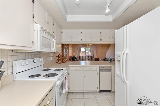 2901 S Palo Verde Ln # 38, Yuma, AZ 85364 - kitchen with white appliances, light countertops, light tile patterned floors, decorative backsplash, and white cabinets