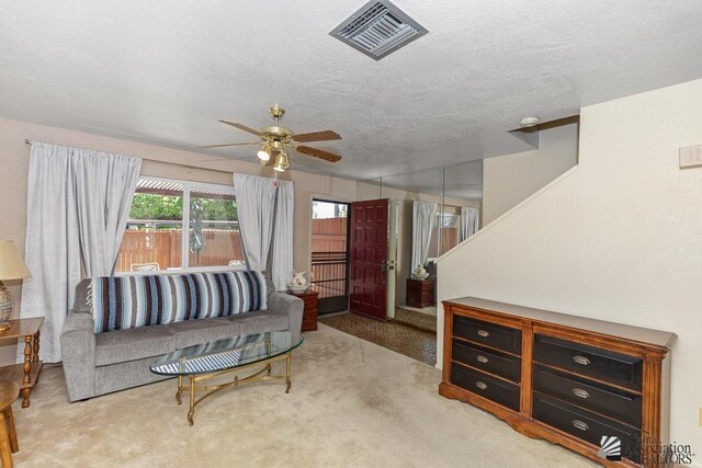 2901 S Palo Verde Ln # 38, Yuma, AZ 85364 - carpeted living room featuring a ceiling fan and a textured ceiling