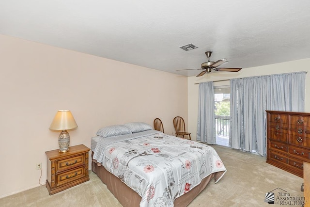 2901 S Palo Verde Ln # 38, Yuma, AZ 85364 - bedroom with light carpet, access to outside, and ceiling fan