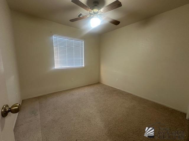 11144 E 26th Pl, Yuma, AZ 85367 - empty room featuring ceiling fan and carpet